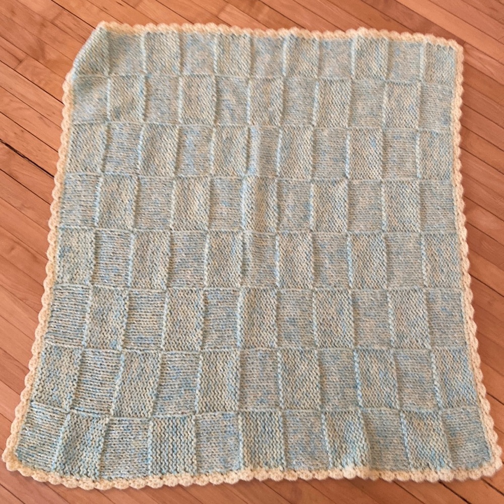 beautiful green baby blanket with yellow edging
